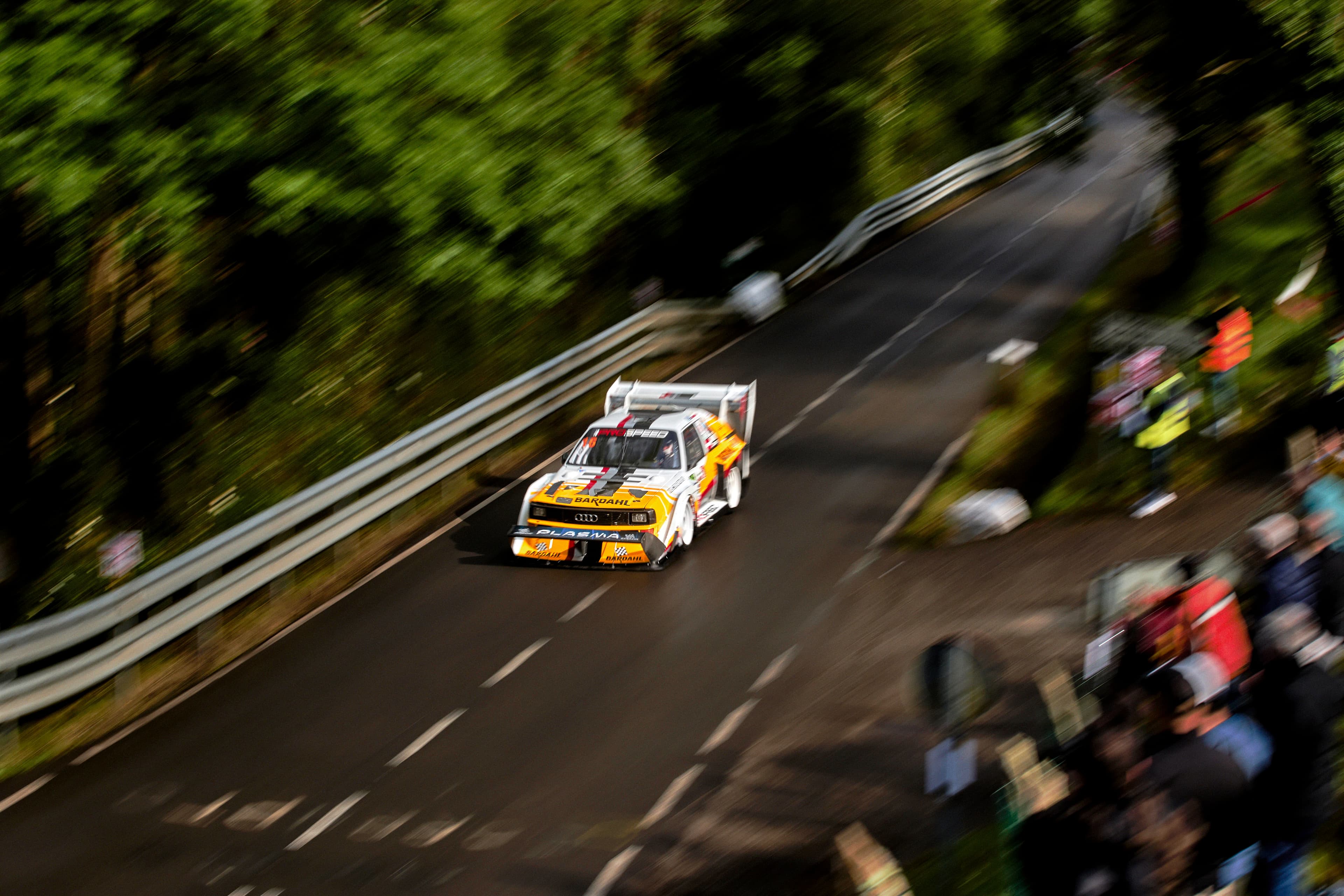 Race car climbing through the forest