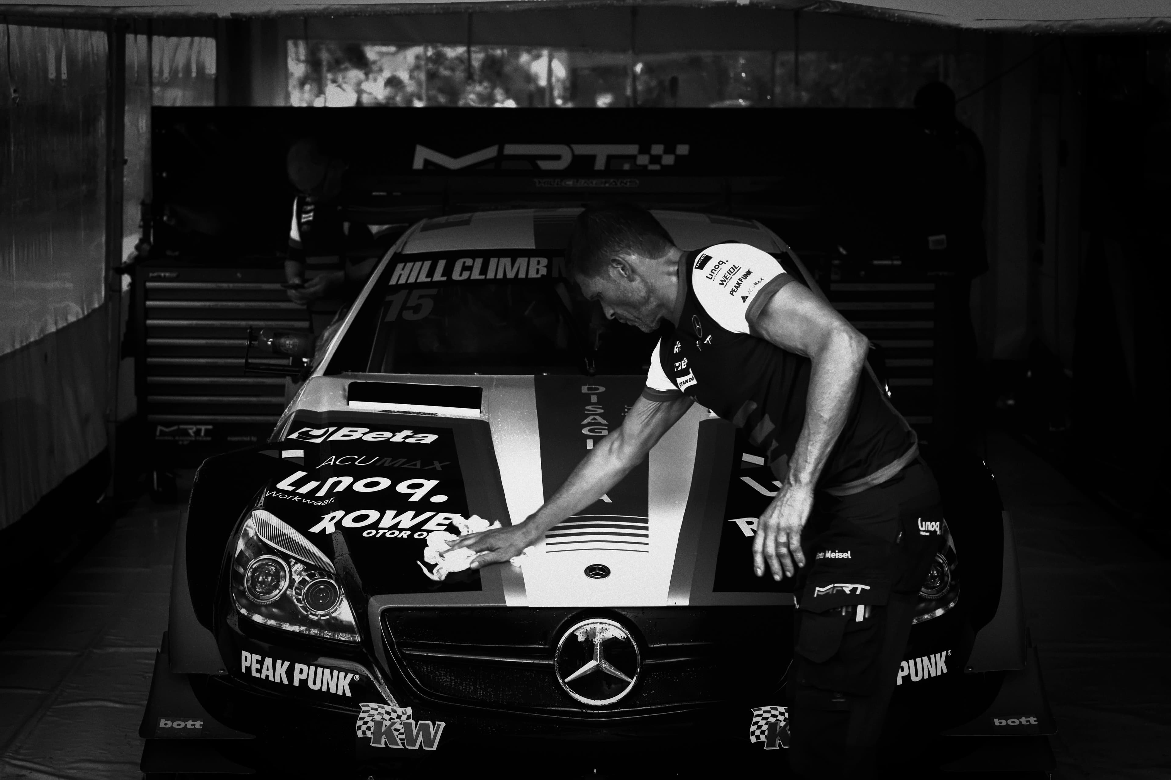 Mechanic preparing race car